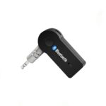 Car Bluetooth Receiver plugged into a car’s aux port, enabling wireless music streaming and hands-free calls in black design.