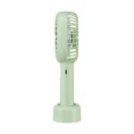 DP-7631 Rechargeable Mini Handheld Fan with detachable base on a desk, blowing cool air, compact design with 2000mAh battery.