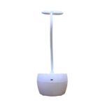 SOGO JPN-1302 white LED study lamp with mobile holder, dimmable light, and USB-rechargeable battery on a desk.